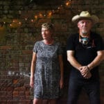 Sally Timms and Jon Langford in the backyard of the Village Works bookstore.